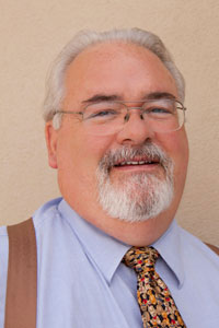 Portrait of Louis James, Managing Director